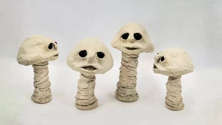 little mushroom with eyes and a mouth made from masking tape