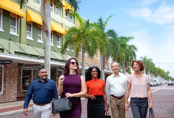 Group walking in the Fort Myers River District