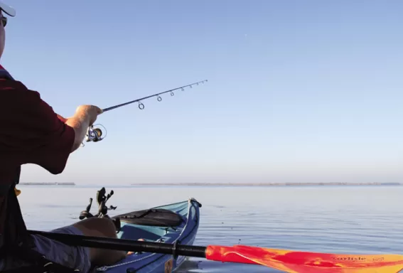 Men kayaking and fishing